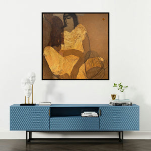 'Village Women (Golden Solitude)' painting by Siddharth Shingade shown on a wall in a furnished room.