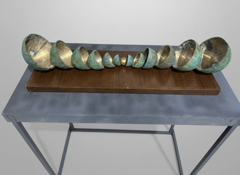 'Which One Is Me' contemporary Bronze sculpture by artist Sahil Mehra, 12x36 inch, on bronze