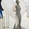 Figurative sculpture titled 'Wings Are Ready To Fly But Cant', 31x31x24 inches, by artist Navjot Sohal on Resin, Silicon