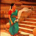 Figurative oil painting titled 'Woman at the Temple Step', 24x17 inches, by artist S  Elayaraja on Canvas