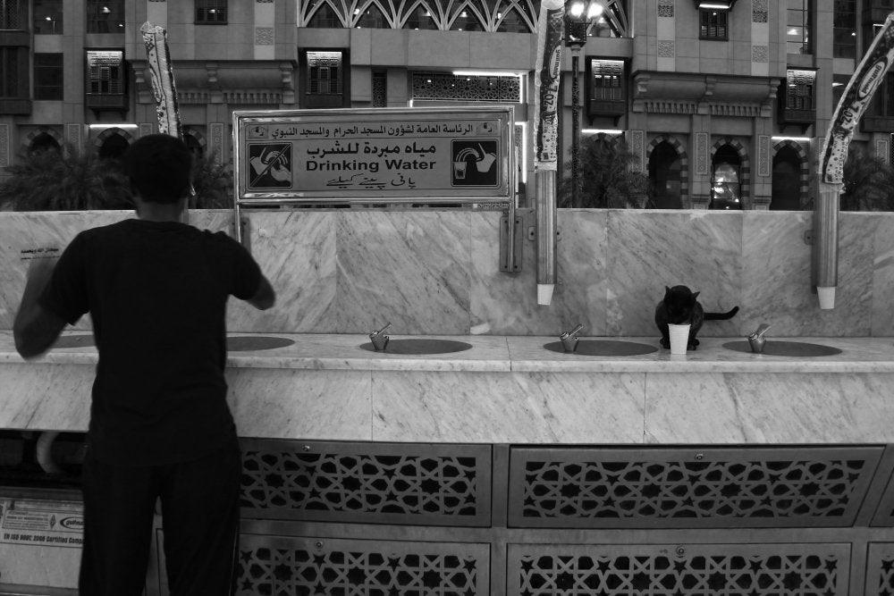 Motivational photography titled 'Zam Zam Water For All', 11x17 inches, by artist Rahmat Nugroho on